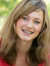 teen girl smiling and wearing braces